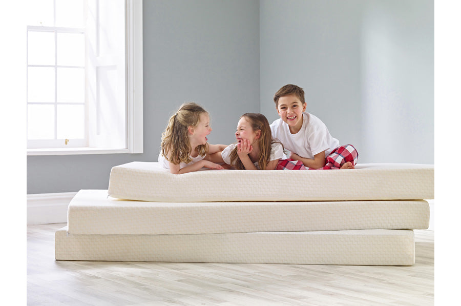 Little Boy pulling a mattress